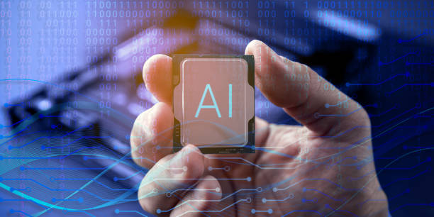 istock AI-enabled hardware marketing, robotics research, smart devices, automation industries. Hand holding microchip labeled AI. Symbol artificial intelligence technology and its integration with hardware 2194218196