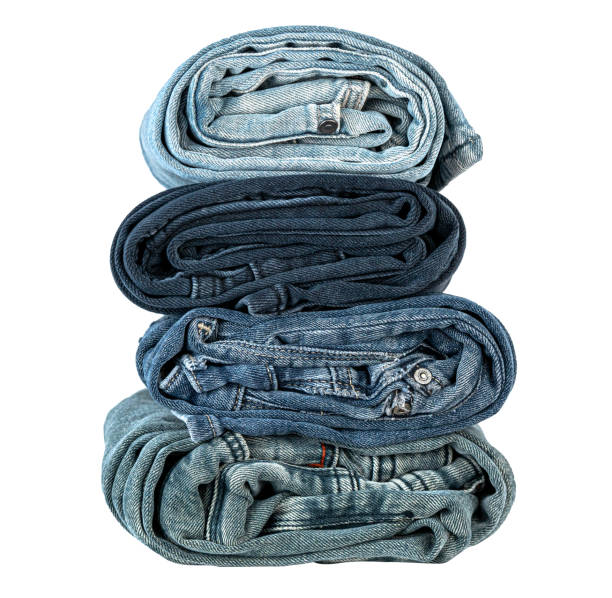 Close-up of folded jeans isolated on white background