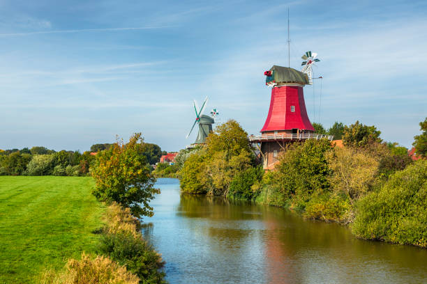 Twin windmills at the village of Greetsiel, East Frisia, Lower Saxony, Germany