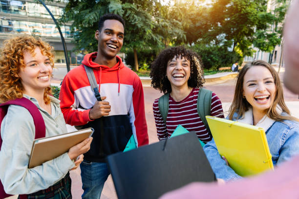 istock Happy young college students talking together on campus 2194219587