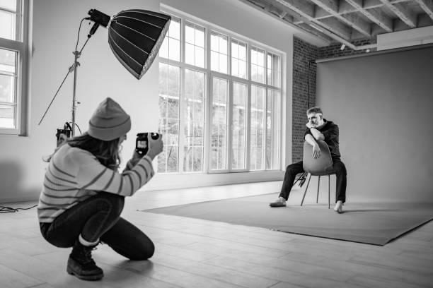 istock Black and white photo of a portrait studio session 2194221000
