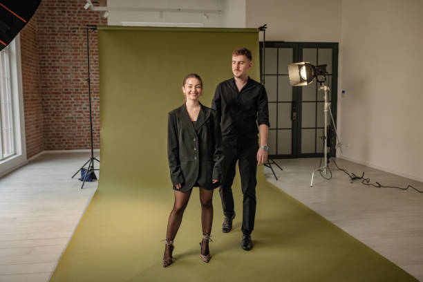 istock Dynamic duo posing in fashion-forward studio photoshoot. 2194222617