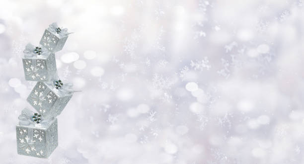 istock New Year Christmas background, postcard. Gift silver boxes on a winter frosty background. 2194222929
