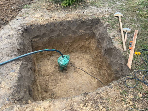 istock Water well sump surrounded by green fields 2194224443