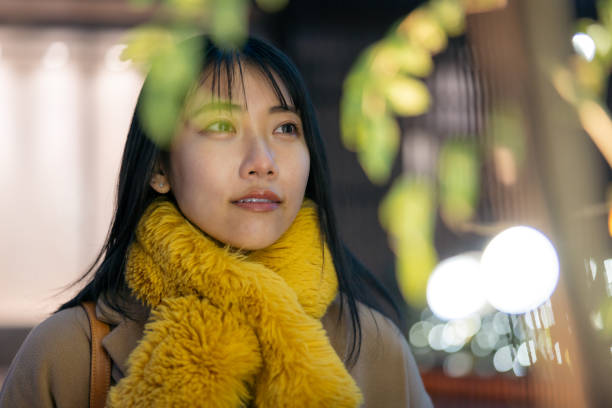 istock Young female freelance worker looking at illumination at night 2194224771
