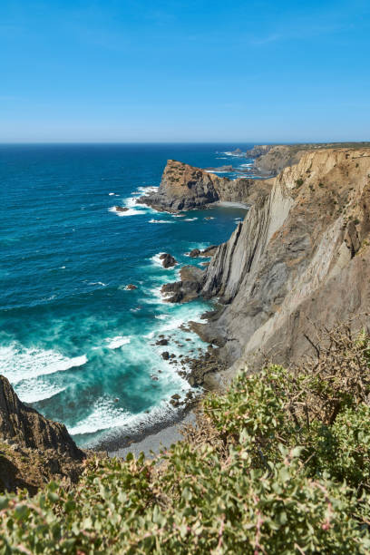 istock Breathtaking coastal scene with sheer cliffs plunging into the vibrant turquoise ocean. Fortaleza da Arrifana, Portugal 2194224801