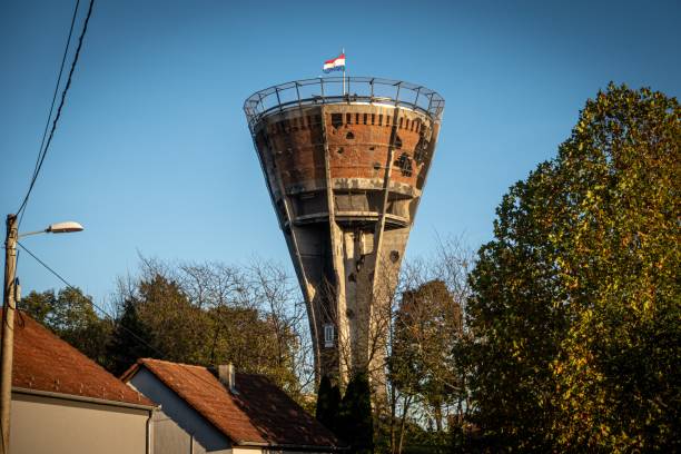 A tall water tower featuring a Croatian flag