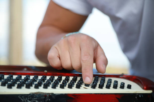 istock Man Testing All The Buttons Of His Accordion 2194225089