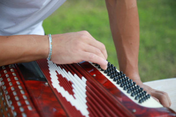 istock Man Testing All The Buttons Of His Accordion 2194225090