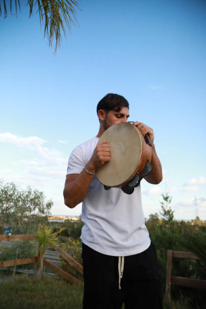 istock Skilled Tambourine Player in Vast Countryside 2194225345