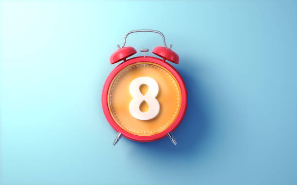 istock Red Alarm Clock with Orange Inside and White Digit 8 on Light Blue Soft Background 2194225544