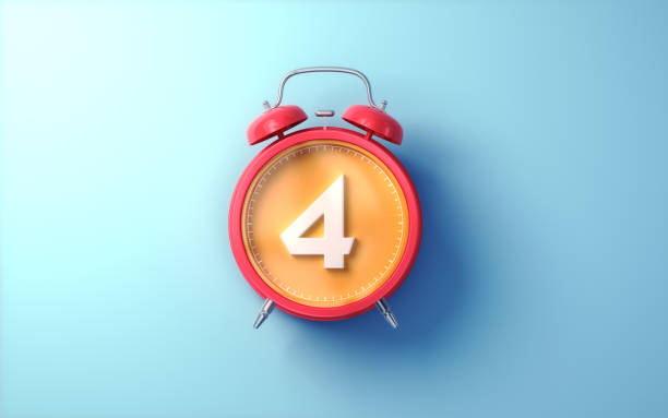 istock Red Alarm Clock with Orange Inside and White Digit 4 on Light Blue Soft Background 2194225637