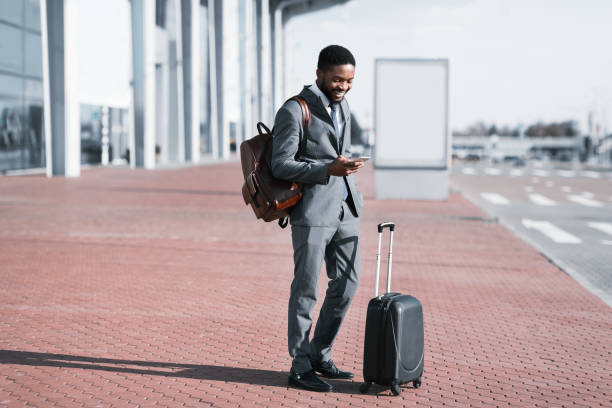 istock Arrival at Airport. Businessman Checking E-mail On Mobile Phone 2194228425