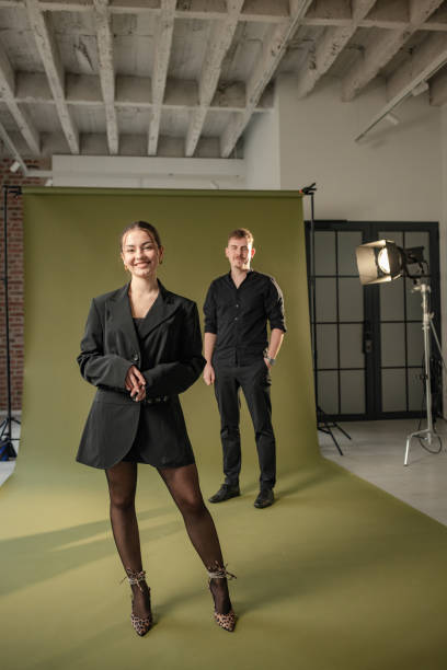 istock Studio photoshoot with green backdrop and two models. 2194230249