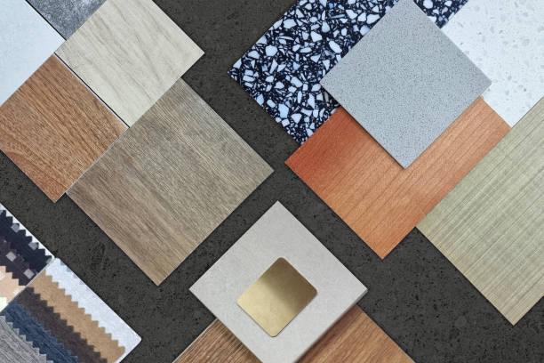 istock palette of interior material samples in top view contains wooden tiles, artificial stone, terrazzo, gold stainless, drapery, laminated placed on black marble stone table. 2194231037