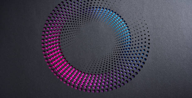 istock Circular gradient pattern of perforated black paper revealing vibrant pink and blue hues, creating a dynamic effect. 2194231331