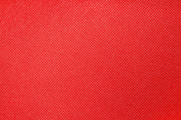 istock a close-up of a red fabric featuring a fine textured pattern. 2194231445