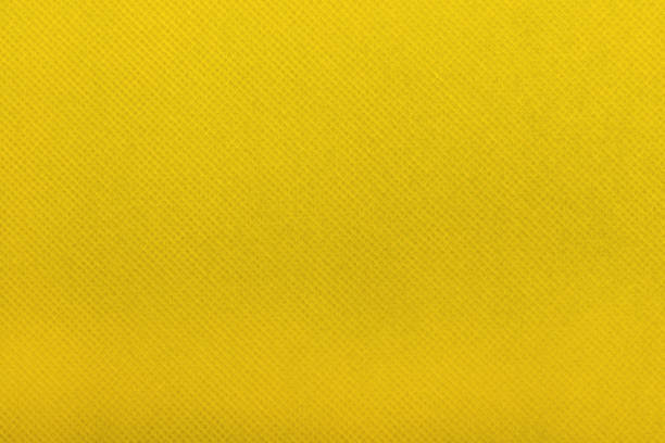 istock a close-up of a yellow fabric featuring a fine textured pattern. 2194231456