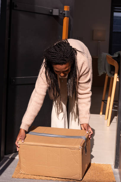istock Woman Collecting a Package. 2194231681