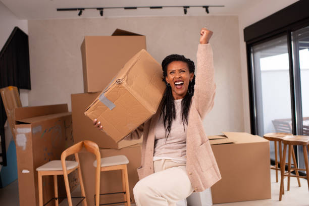 istock Woman Celebrating Success During Moving Day. 2194231763