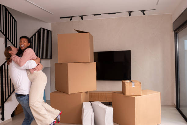 istock Couple Celebrating a New Home Amidst Moving Boxes. 2194231803