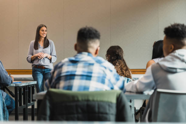 istock Female Teacher Leading Engaging Classroom Discussion with Students 2194233438