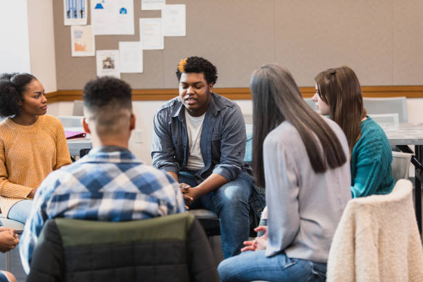 istock Group Therapy Session: Diverse Young Adults Discussing Mental Health 2194233529