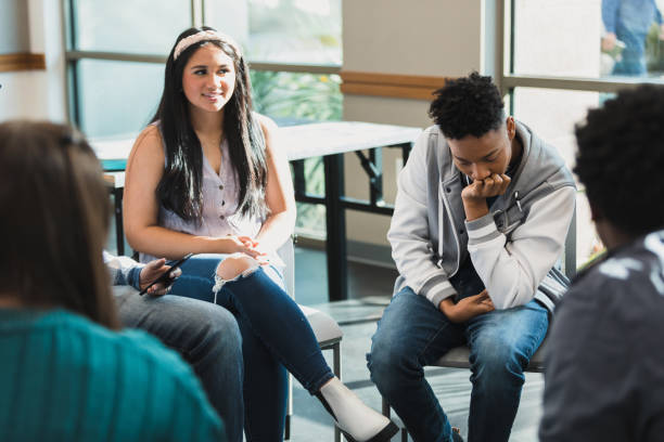 istock Teenagers and young adults in group therapy session 2194233545