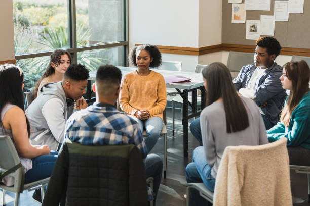 istock Group Therapy Session: Diverse Young Adults Discussing Mental Health 2194233571