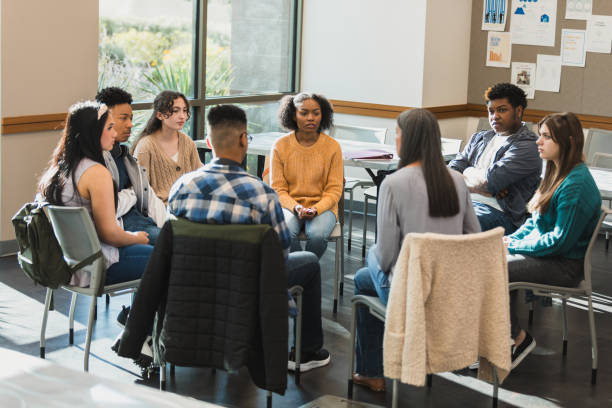 istock Group Therapy Session: Diverse Young Adults in Discussion 2194233575