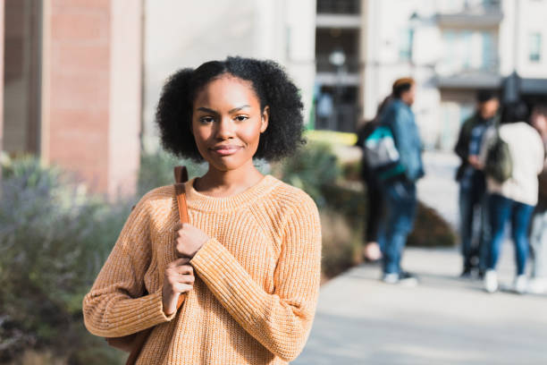 istock Confident Young Woman Student on Campus,  Smiling Outdoors 2194233614