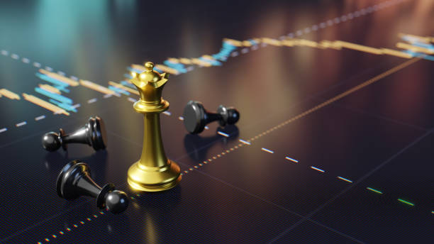 istock Golden Chess Queen Among Fallen Pawns on Digital Screen Financial Graph Background 2194234814