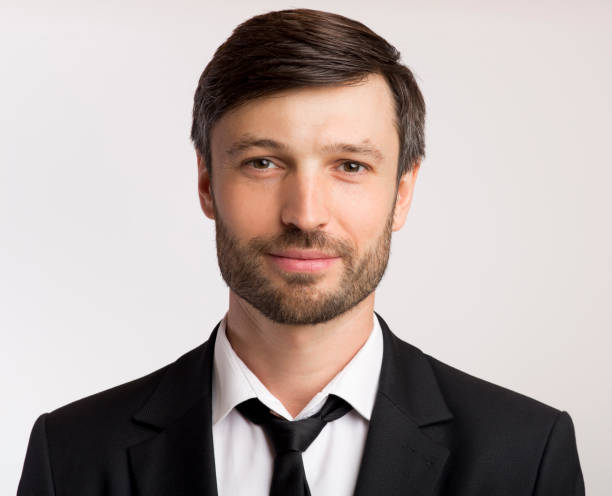 istock Professional Man in Formal Attire Posing Against a Neutral Background 2194237163