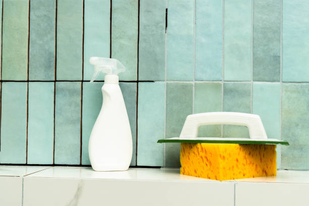 istock Epoxy grout repair tools and supplies arranged on tile surface during home improvement project 2194237477