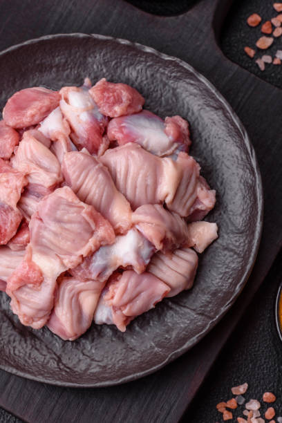 istock Raw chicken or turkey stomach with salt, spices and herbs 2194239110