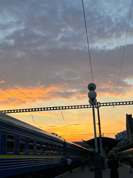 istock Train at the Platform with Sunrise in the Background 2194240454