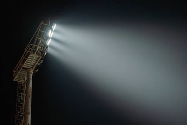 istock Stadium lights illuminating night sky during sporting event 2194241937