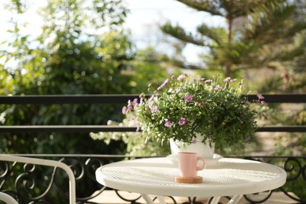 istock Pink ceramic coffee cup on white metal table vintage outdoor 2194242754
