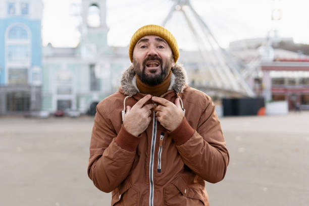 istock Freezing bearded man pulling up his collar in cold weather 2194242860