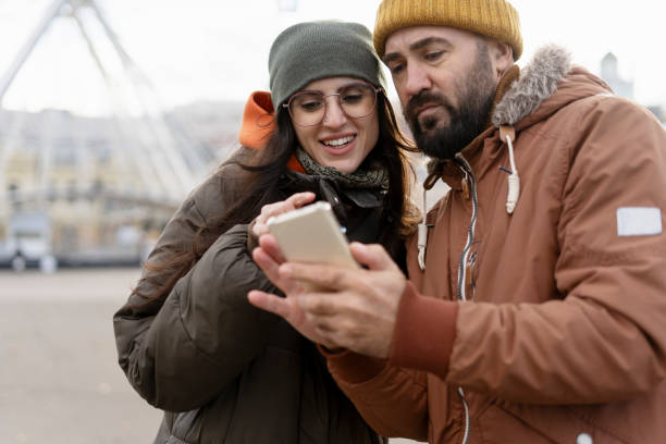 istock Tourists using smartphone app, exploring the city using mobile phone gps 2194242869