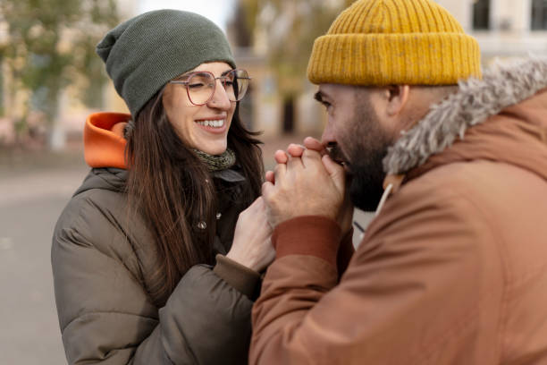 istock Loving couple warming hands and sharing tender moment outdoors in autumn 2194242872