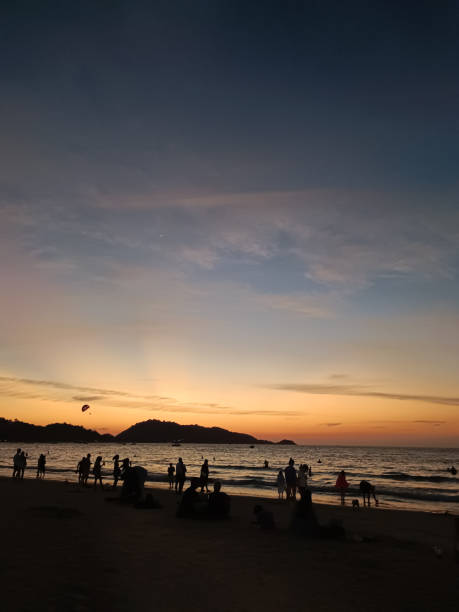 istock Busy beach at sunset, Phuket island, Thailand 2194243235