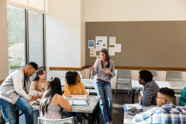 istock Teacher Leading a Discussion with Students in a Classroom 2194243735