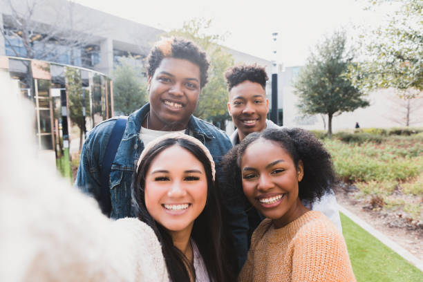 istock Multiracial Group of Happy Students Taking a Selfie 2194243749