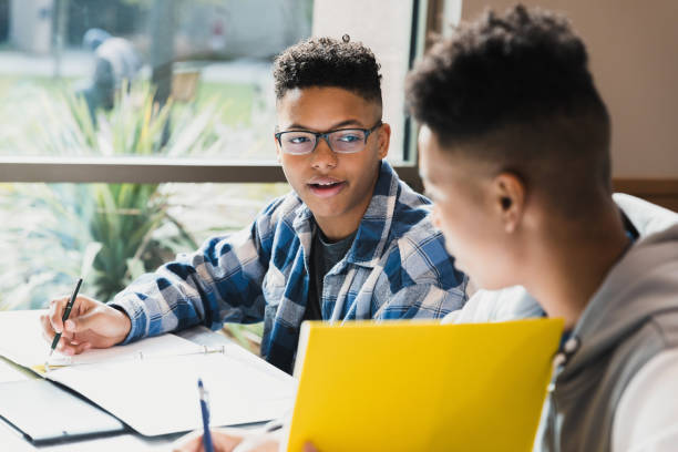 istock Two Male Students Studying Together in Classroom 2194243755