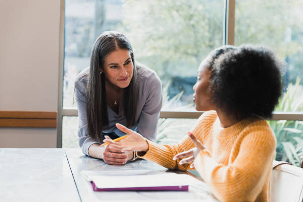 istock Two Women in Casual Clothing Having a Discussion 2194243771