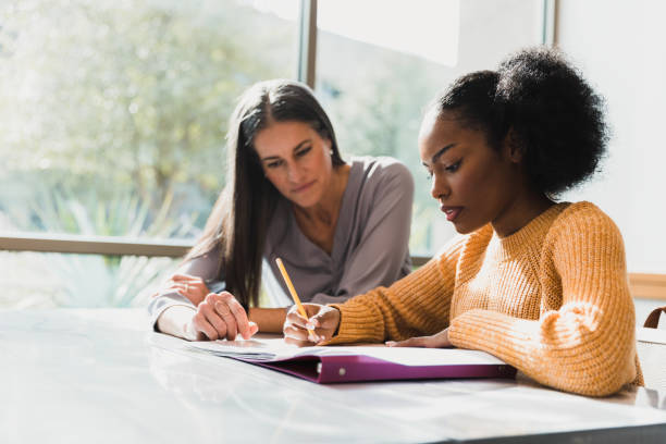 istock Two Women Collaborating, Mentoring, and Studying Together 2194243778