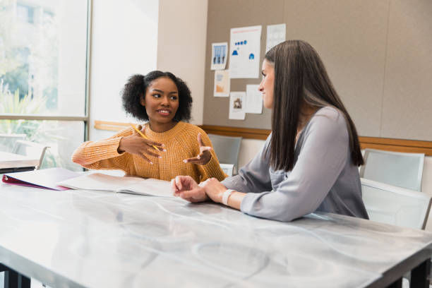 istock Two Women Talking During a Meeting, Casual Business 2194243781