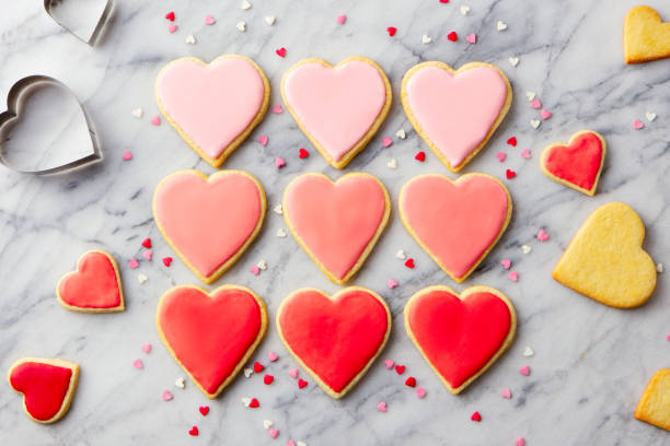 istock Cookies heart shaped on a marble board. St. Valentines dessert. Marble background. Top view. 2194243820