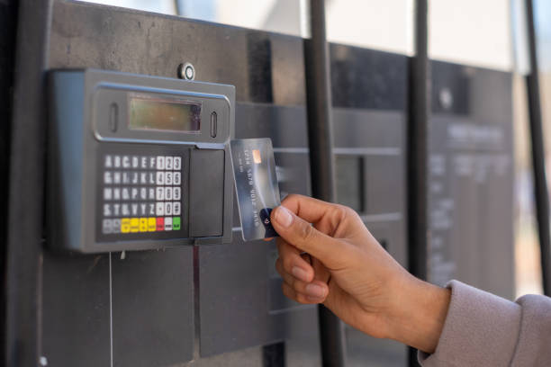 istock Woman using credit card on self service terminal 2194245370